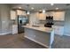 Bright kitchen featuring stainless steel appliances, granite counters, and a large center island at 12127 Storke Ave, Port Charlotte, FL 33981