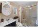 Bathroom featuring a shower with glass doors, a sink with cabinet, and decor at 1507 45Th Avenue E Dr, Ellenton, FL 34222