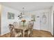 Inviting dining room features wood floors, a table with seating, and neutral decor at 1507 45Th Avenue E Dr, Ellenton, FL 34222
