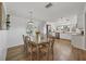 Dining Room with wood floors and decorative table that opens up to the kitchen at 1507 45Th Avenue E Dr, Ellenton, FL 34222