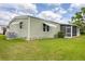 Well-kept home with green lawn and screened porch, showcasing outdoor living and property's appeal at 1507 45Th Avenue E Dr, Ellenton, FL 34222