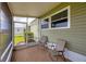 Inviting screened porch with outdoor seating, perfect for relaxing and enjoying the views at 1507 45Th Avenue E Dr, Ellenton, FL 34222