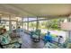 Relaxing sunroom featuring comfortable seating and abundant natural light at 1507 45Th Avenue E Dr, Ellenton, FL 34222