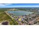 Stunning aerial view of lakeside home in vibrant community with mature landscaping and breathtaking water views at 1657 Bonita Bluff Ct, Ruskin, FL 33570