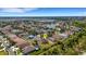 Beautiful aerial view of backyard oasis, featuring screened pool, sports court and inviting fire pit at 1657 Bonita Bluff Ct, Ruskin, FL 33570