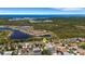 Aerial view showcasing the home's location near lakes, conservation areas, and a stunning coastal backdrop at 1657 Bonita Bluff Ct, Ruskin, FL 33570