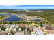 Breathtaking aerial view highlighting the home's prime location near natural lakes and scenic wetlands at 1657 Bonita Bluff Ct, Ruskin, FL 33570