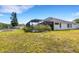 A beautiful backyard with a screened-in pool and a white PVC fence at 1657 Bonita Bluff Ct, Ruskin, FL 33570