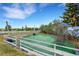 Backyard featuring a fenced area, green turf, and a swing set at 1657 Bonita Bluff Ct, Ruskin, FL 33570