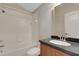 Well-lit bathroom with a shower over tub, single sink vanity, and modern fixtures at 1657 Bonita Bluff Ct, Ruskin, FL 33570
