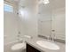 Well-lit bathroom featuring a tub with shower, granite countertop, and sleek, modern fixtures at 1657 Bonita Bluff Ct, Ruskin, FL 33570