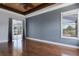 Bedroom featuring hardwood flooring, sliders to porch, and large window at 1657 Bonita Bluff Ct, Ruskin, FL 33570