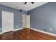 Bedroom featuring laminate flooring, a closet and a door at 1657 Bonita Bluff Ct, Ruskin, FL 33570