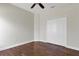 Comfortable bedroom with hardwood floors, a ceiling fan, and closet space; ideal for relaxation at 1657 Bonita Bluff Ct, Ruskin, FL 33570
