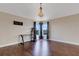 Open bonus room with chandelier, hardwood floors, natural light, and a TV mount at 1657 Bonita Bluff Ct, Ruskin, FL 33570