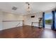 Bonus room features a chandelier, natural light from the window, and hardwood floors at 1657 Bonita Bluff Ct, Ruskin, FL 33570