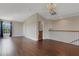 Large room with hardwood floors, chandelier, bright window, and stairway access, great for flexible use at 1657 Bonita Bluff Ct, Ruskin, FL 33570