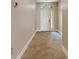 Bright foyer featuring tile floors, a white front door with a window, and an open entryway at 1657 Bonita Bluff Ct, Ruskin, FL 33570