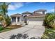 Charming two-story home featuring a two-car garage and tropical landscaping in a desirable neighborhood at 1657 Bonita Bluff Ct, Ruskin, FL 33570