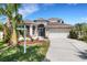 Charming two-story home featuring a two-car garage and tropical landscaping in a desirable neighborhood at 1657 Bonita Bluff Ct, Ruskin, FL 33570
