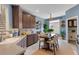 Stylish kitchen with stainless steel appliances, wooden cabinets, and a cozy dining area at 1657 Bonita Bluff Ct, Ruskin, FL 33570