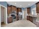 This kitchen features ample counter space, stainless steel appliances, and dark wood cabinets at 1657 Bonita Bluff Ct, Ruskin, FL 33570