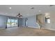 Spacious living room with tile floors, recessed lighting, and access to the outdoor pool area at 1657 Bonita Bluff Ct, Ruskin, FL 33570