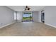 Large living room featuring tile floors, recessed lighting, and sliding glass doors leading to a patio at 1657 Bonita Bluff Ct, Ruskin, FL 33570