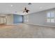 Spacious living room with neutral tile floors, recessed lighting, and plantation shutters at 1657 Bonita Bluff Ct, Ruskin, FL 33570
