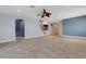 Spacious open living room with tile flooring, fan, and views to the kitchen and staircase at 1657 Bonita Bluff Ct, Ruskin, FL 33570