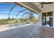 Gorgeous screened-in pool features a waterfall feature, a spa, and a spacious brick patio at 1657 Bonita Bluff Ct, Ruskin, FL 33570