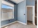 Corner of a room with light, a window, and a door to another room with counters at 1657 Bonita Bluff Ct, Ruskin, FL 33570