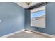 Stylish room with a modern window that brings in plenty of natural light and blue colored walls at 1657 Bonita Bluff Ct, Ruskin, FL 33570