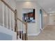 Welcoming staircase with views of the kitchen and the front door area of the house at 1657 Bonita Bluff Ct, Ruskin, FL 33570