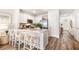 Modern kitchen featuring white cabinets, a center island, and stainless steel appliances at 17429 Haysack Ter, Lakewood Ranch, FL 34211