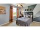 Contemporary bedroom with a modern color scheme, featuring a cozy bed, decorative art, and natural light at 18110 Metado Dr, Lakewood Ranch, FL 34211