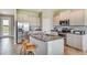 Well-appointed kitchen featuring granite countertops, stainless steel appliances, and an island with barstool seating at 18110 Metado Dr, Lakewood Ranch, FL 34211