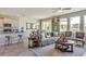 Spacious living area with open layout connecting the kitchen, dining, and living rooms, perfect for entertaining at 18110 Metado Dr, Lakewood Ranch, FL 34211