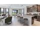 Open-concept kitchen featuring dark wood cabinets, granite countertops, and bar seating with lake view at 18114 Metado Dr, Bradenton, FL 34211