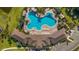 Overhead view of the community pool and clubhouse, surrounded by lush landscaping at 18204 Metado Dr, Lakewood Ranch, FL 34211
