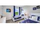 Cheerful bedroom with twin beds, colorful decor, and plenty of natural light at 18216 Canopy Pl, Lakewood Ranch, FL 34211