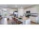 Bright, open kitchen with a large center island, stainless steel appliances, and sleek countertops at 18216 Canopy Pl, Lakewood Ranch, FL 34211