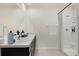 The bathroom features a double sink vanity, a walk-in shower, and neutral color scheme at 18220 Canopy Pl, Lakewood Ranch, FL 34211