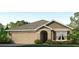 Charming one-story home featuring an attached two-car garage and well manicured landscaping at 18220 Canopy Pl, Lakewood Ranch, FL 34211