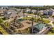 Community playground with swings, slides, and picnic tables surrounded by well-maintained landscaping at 18220 Canopy Pl, Lakewood Ranch, FL 34211