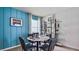 Cozy dining room featuring a marble-topped table set for four and stylish display shelves at 18220 Wheathouse Pl, Lakewood Ranch, FL 34211