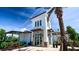 Modern clubhouse exterior with stone accents, covered entrance, and professional landscaping at 18220 Wheathouse Pl, Lakewood Ranch, FL 34211