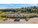 Community clubhouse with manicured landscaping, a fountain, and ample parking at 18223 Canopy Pl, Lakewood Ranch, FL 34211