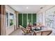Bright office with a view featuring a modern desk and lush faux living wall at 18223 Canopy Pl, Lakewood Ranch, FL 34211