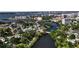 A captivating aerial view of a residential neighborhood nestled alongside a tranquil river and downtown area at 1830 Virginia Dr, Bradenton, FL 34205